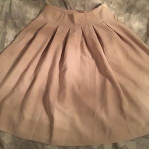 nude pink pleated skirt